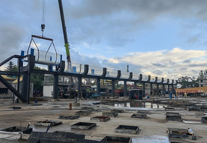 A marine engineering project site, with a strong construction team